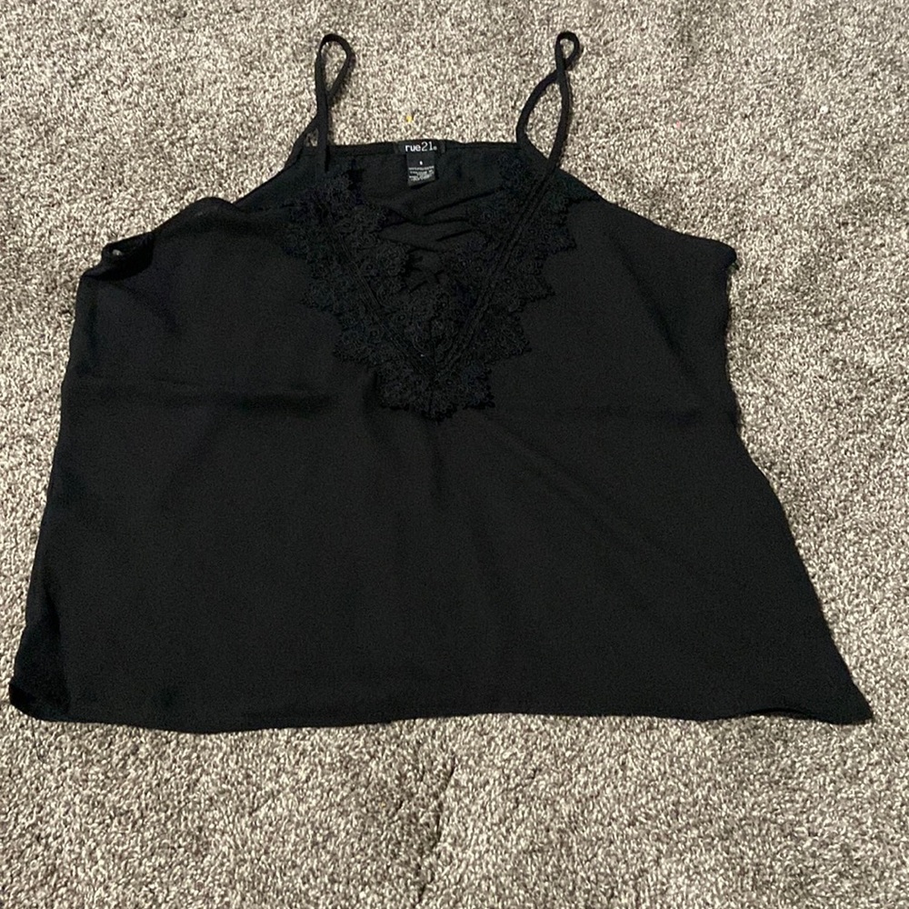 Black tank top with lace design at top.